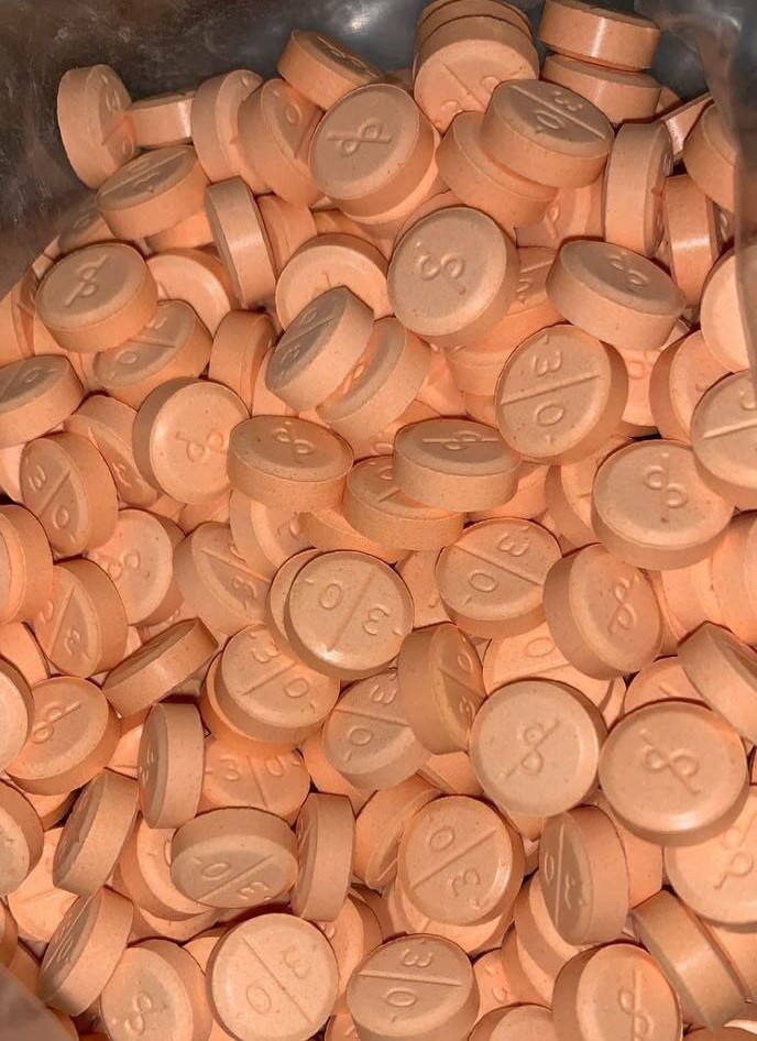 Close-up of Adderall tablets for ADHD treatment – fast-acting stimulant medication, available online without prescription and shipped securely in the USA.